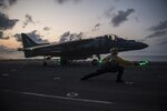 Aviation Boatswain™s Mate (Handling) 2nd Class Morgan Jackson, from Los Angeles, gives the signal for an AV-8B Harrier, assigned to the Ridge Runners of Marine Medium Tiltrotor Squadron (VMM) 163, to take off from the flight deck of the amphibious assault ship USS Makin Island (LHD 8), April 12, 2017. Makin Island, the flagship for the Makin Island Amphibious Ready Group, with the embarked 11th Marine Expeditionary Unit, is operating in the Indo-Asia-Pacific region to enhance amphibious capability with regional partners and to serve as a ready-response force for any type of contingency. 