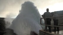 Two U.S. Army Corps of Engineer Rangers observe the "Rooster Tail", Lucky Peak Dam, May 25, 2008, Boise, Idaho. A popular springtime attraction is the "Rooster Tail" which results from the discharge of water through the original release structures of the dam under pressure from the lake above.  Using a "flip bucket" to direct the spray high into the air, the erosive, scouring force of the water is greatly dissipated as it rises, rests and slowly falls back to the stream channel.
The Rooster Tail only uses water from large releases required for flood risk management that exceed powerhouse capacity, thus no water is wasted for the display.   
It occurred daily until 1986 when construction of the Lucky Peak Power Plant Project started.  
