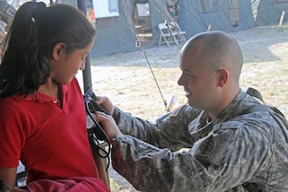 1st Lt. Dallin Peterson, a preventative medicine officer assigned to the Utah National Guard's 19th Special Forces Group, checks vitals on a young patient April 9, 2017, during a free medical event held in Ladyville, Belize as a part of Beyond the Horizon 2017.  BTH 2017 is an on-going partnership exercise between the Government of Belize and U.S. Southern Command that will provide three free medical service events and five construction projects throughout the country of Belize from March 25 until June 17. (U.S. Army Photo by Staff Sgt. Fredrick Varney, 131st Mobile Public Affairs Detachment)