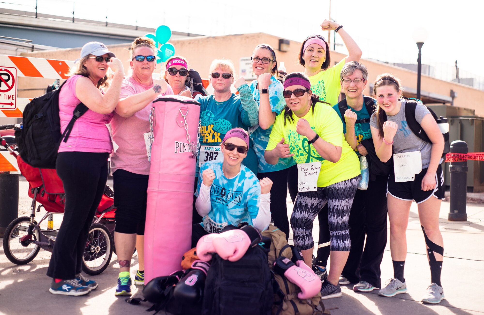 Women with Pink Gloves Boxing rucked with 40-pound ruck sacks during the 2017 Sexual Assault Awareness and Prevention 5k Ruck, Run, or Walk event on April 8, 2017 in Cheyenne, Wyoming.
  
This annual event is designed to bring awareness to sexual assault and show support to sexual assault victims. (Courtesy Photo by Daniel de La Fé)