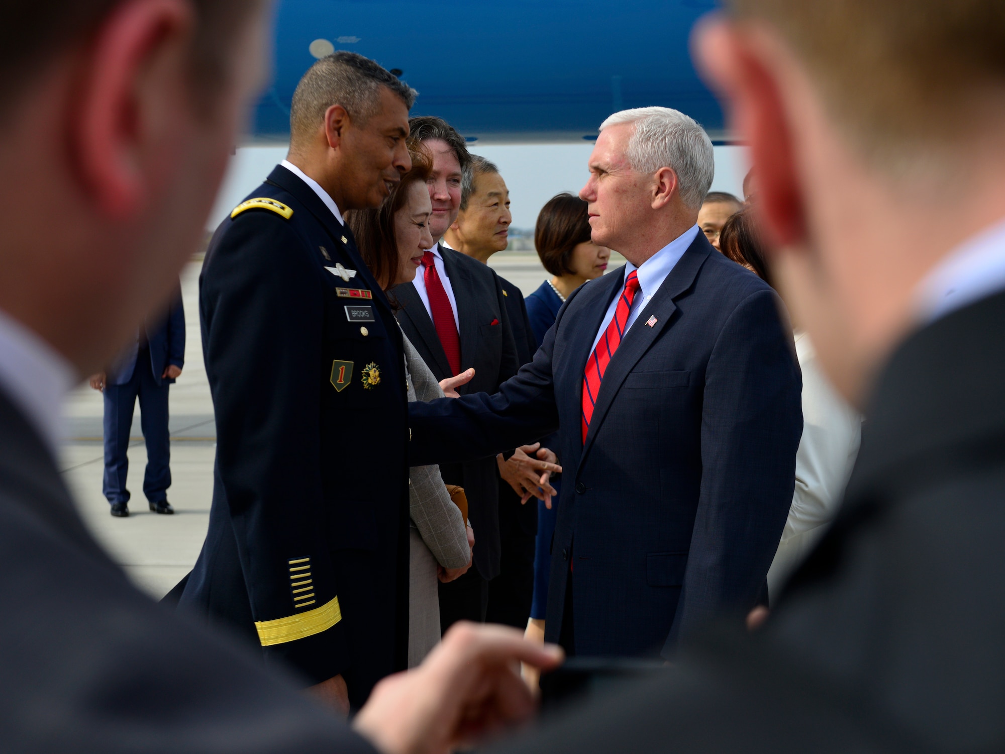 U.S. Vice President of the United States Mike R. Pence greets U.S. Army Gen. Vincent K. Brooks, United States Forces Korea commander, after landing at Osan Air Base, Republic of Korea, April 16, 2017. Pence’s visit to Korea highlighted the importance of the U.S. – ROK alliance, and how teamwork will be vital to deterring regional threats and maintaining stability on the Korean peninsula. (U.S. Air Force photo by Staff Sgt. Alex Fox Echols III)