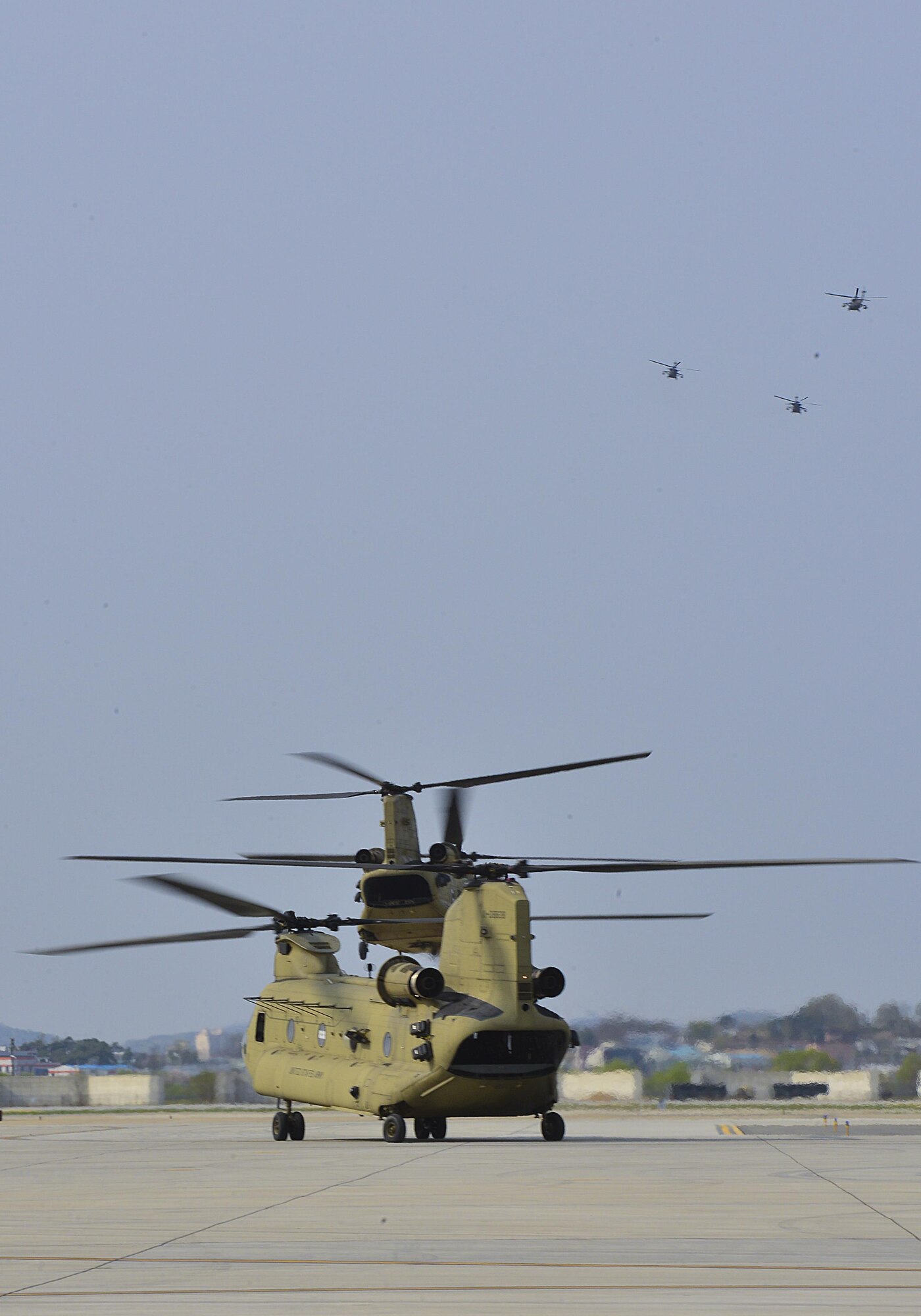 A group of helicopters depart from the flightline during Vice President of the United States Mike R. Pence's visit at Osan Air Base, Republic of Korea, April 16, 2017. The visit, which marked the most senior member of the Trump administration to visit Korea, underscored how the long alliance between the U.S. and the ROK is a linchpin of peace and prosperity in the Asia-Indo-Pacific region and the commitment the U.S. government has to support its regional allies. (U.S. Air Force photo by Airman 1st Class Gwendalyn Smith)