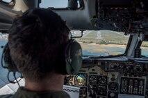 A U.S. Air Force pilot from the 961st Airborne Air Control Squadron approaches the runway of Kadena Air Base, Japan, March 28, 2017. In support of air-to-ground operations, the Sentry can provide direct information needed for interdiction, reconnaissance, airlift and close-air support for friendly ground forces. (U.S. Air Force photo by Senior Airman John Linzmeier/released)