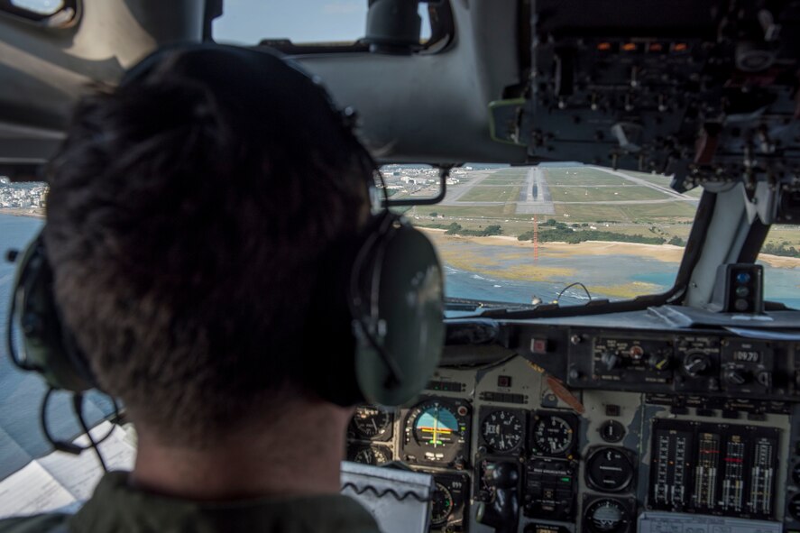 A U.S. Air Force pilot from the 961st Airborne Air Control Squadron approaches the runway of Kadena Air Base, Japan, March 28, 2017. In support of air-to-ground operations, the Sentry can provide direct information needed for interdiction, reconnaissance, airlift and close-air support for friendly ground forces. (U.S. Air Force photo by Senior Airman John Linzmeier/released)