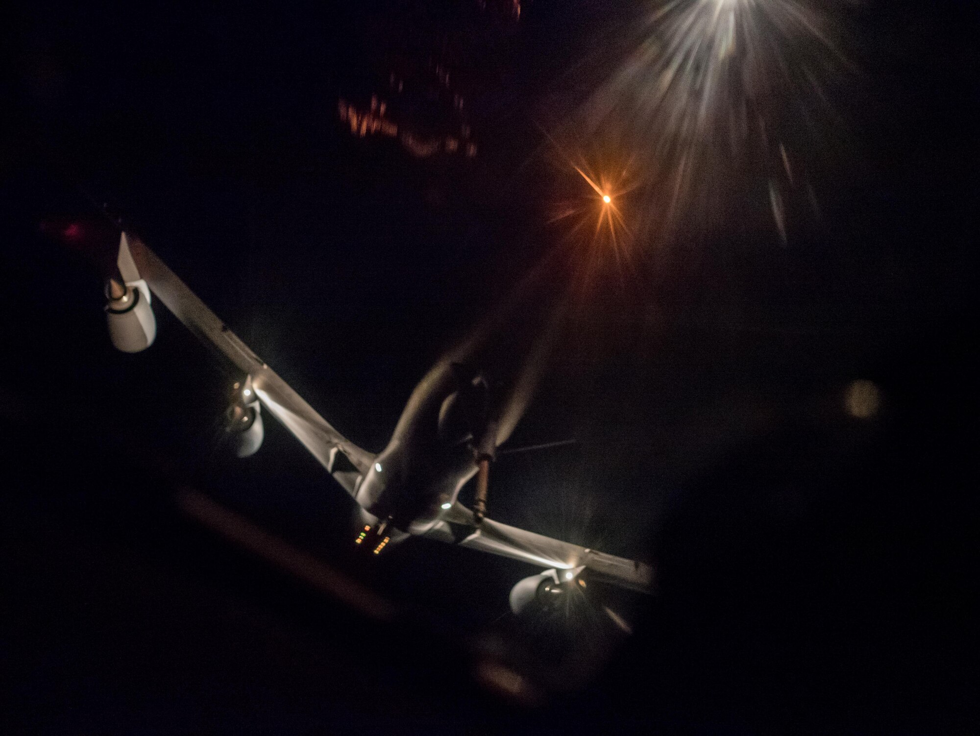 A U.S. Air Force KC-135 Stratotanker from the 909th Air Refueling Squadron prepares to conduct aerial refueling with an E-3 Sentry from the 961st Airborne Air Control Squadron March 28, 2017, over the Pacific Ocean. The 909th ARS provides combat-ready KC-135 tanker aircrews to support peacetime operations and all levels of conflict in the Indo-Asia-Pacific theater. (U.S. Air Force photo by Senior Airman John Linzmeier/released)