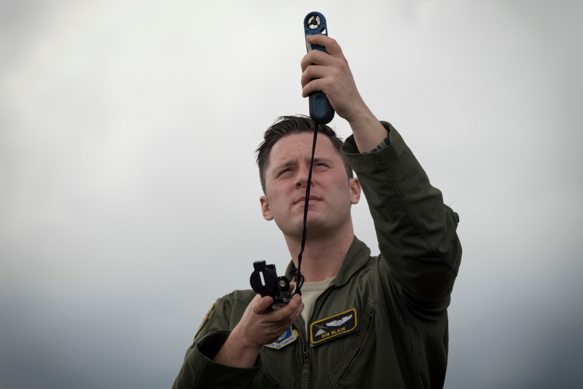 1st Lt. Robert Black, 36th Airlift Squadron C-130 pilot, takes wind readings while waiting for supplies dropped from C-130H Hercules during a training mission at Combined Armed Training Center Camp Fuji,  April 12, 2017. Airmen from the 374th Logistics Readiness Squadron and Eagle airlifts with the 36th AS conducted mass containerized delivery system airdrop training. (U.S. Air Force photo by Yasuo Osakabe)