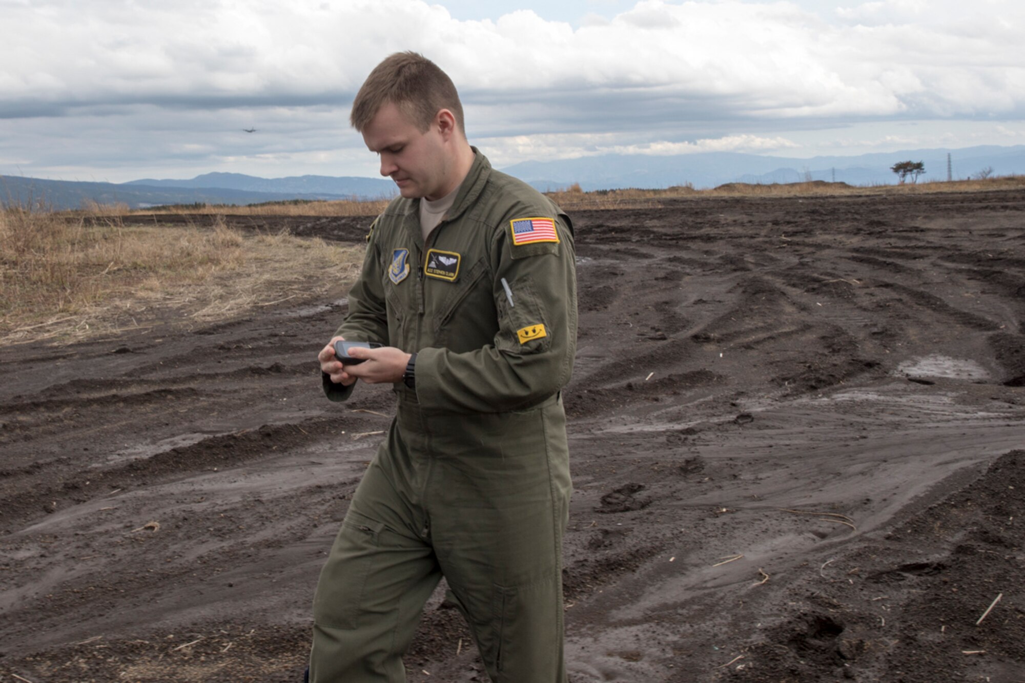 Airman 1st Class Stephen Clark, 36th Airlift Squadron C-130H loadmaster, checks the Global Positioning System to accurate bundles dropped point at Combined Armed Training Center Camp Fuji, Japan, April 12, 2017. Airmen with the 374th Logistics Readiness Squadron and Eagle airlifts with the 36th Airlift Squadron conducted mass containerized delivery system airdrop training. (U.S. Air Force photo by Yasuo Osakabe)