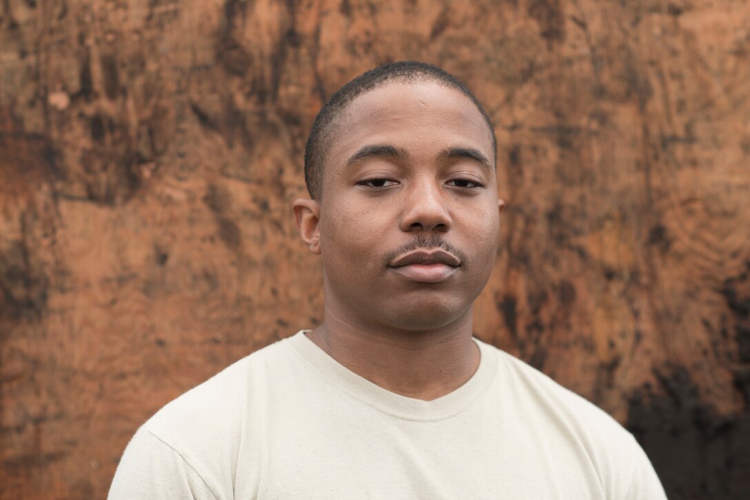 Senior Airman Thomas Jefferson, 374th Logistics Readiness Squadron combat mobility flight recovery specialist, poses for a portrait after recovering ten containerized delivery system bundles at Combined Armed Training Center Camp Fuji, Japan, April 12, 2017. Airmen with the 374th Logistics Readiness Squadron and Eagle airlifts with the 36th Airlift Squadron conducted mass CDS airdrop training. (U.S. Air Force photo by Yasuo Osakabe)