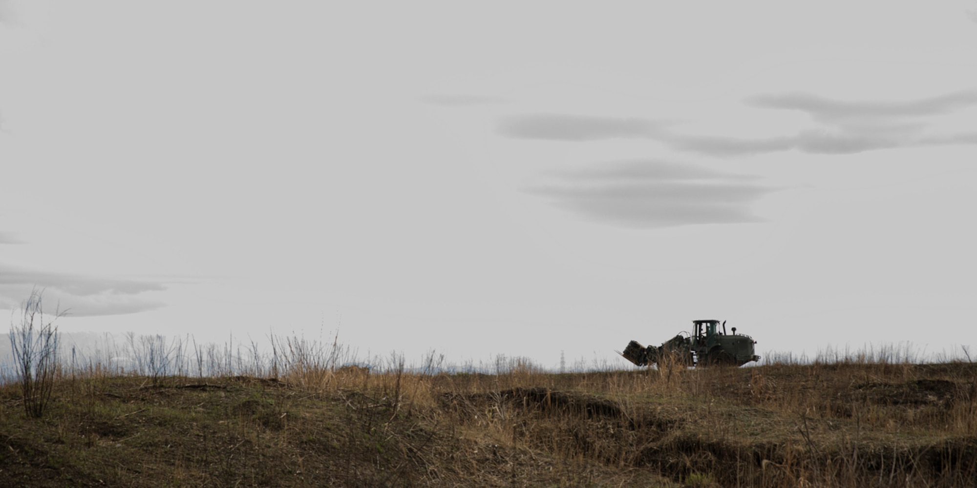 A marine assigned to the Combined Armed Training Center Camp Fuji drives a 10k adverse terrain forklift at CATC Camp Fuji, Japan, April 12, 2017. U.S. Marines supported to recovery mass containerized delivery system bundles, which dropped from a U.S. Air Force C-130H Hercules, assigned to the 36th Airlift Squadron. (U.S. Air Force photo by Yasuo Osakabe)