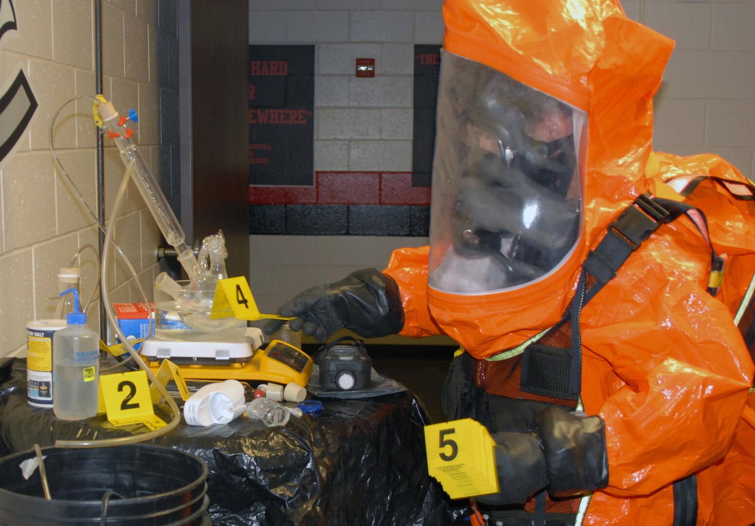 2nd Civil Support Team (CST) member Staff Sgt. Joshua Spagnola uses evidence markers to tag suspected hazardous materials in a mock WMD laboratory during the 2nd CST's training exercise at Joseph L. Bruno Stadium in Troy, N.Y. on April 12, 2017. Team members are trained to identify chemical, biological, and radiological agents and advise first-responders on how to deal with these materials. 