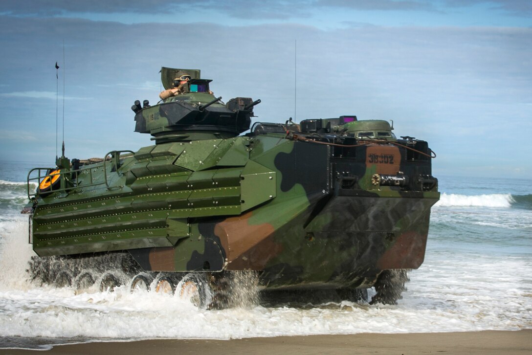 Marines come ashore on amphibious assault vehicles during integration training at Marine Corps Base Camp Pendleton, Calif., April 13, 2017. The Marines are assigned to the 3rd Assault Amphibian Battalion, 15th Marine Expeditionary Unit. The exercise provides the Marines the opportunity to practice with their Navy counterparts to form an efficient team capable of accomplishing a range of missions around the globe. Marine Corps photo by Cpl. Frank Cordoba