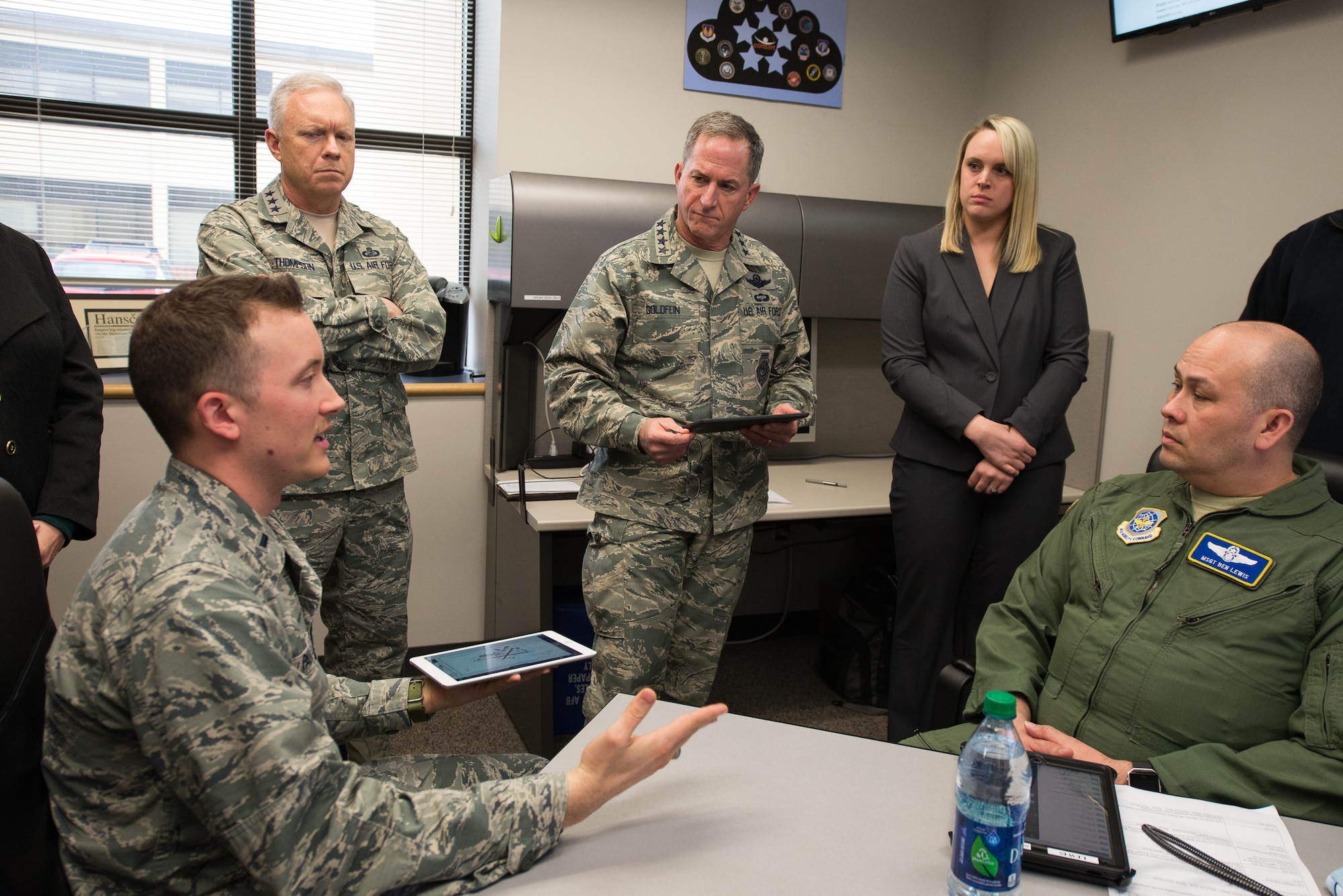 Hanscom Collaboration and Innovation Center Operations Analyst, 1st Lt. Kyle Palko, presents hardened electronic flight bag applications, submitted by private firms, to Air Force Life Cycle Management Center Commander Lt. Gen. John Thompson and U.S. Air Force Chief of Staff, Gen. David L. Goldfein March 28, 2017. Also on hand are EFB PlugTest Program Manager Brittany Ridings and Master Sgt. Benjamin Lewis, Air Mobility Command loadmaster and EFB program expert. Goldfein toured the HCIC and underscored the importance of multi-domain connectivity during his March 28-30 tour of Hanscom. (U.S. Air Force photo/Mark Herlihy)
 
