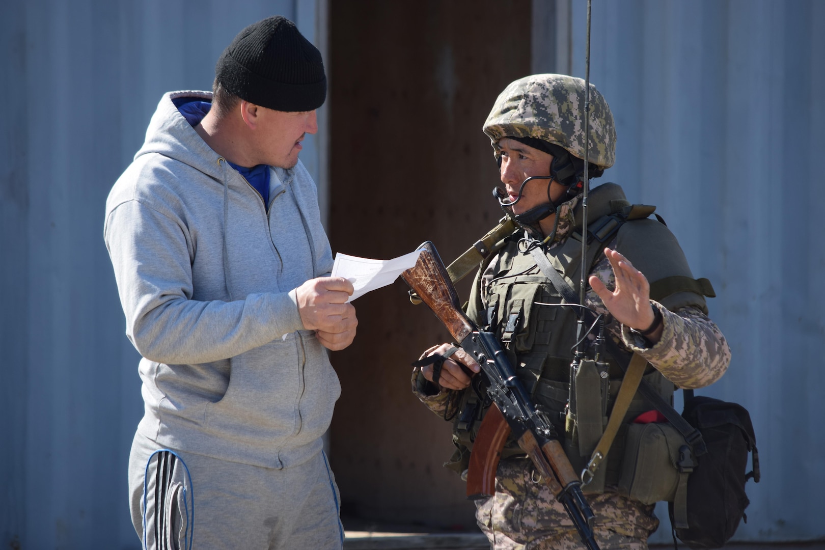 A Kazakhstani soldier practices civil military operations with a citizen role player during a Steppe Eagle Koktem scenario Apr. 10, 2017, at Illisky Training Center, Kazakhstan. Civil Military operations are critical tasks in peacekeeping operations.