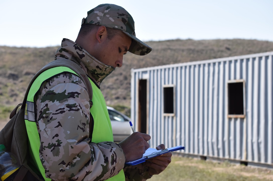 A Kazakhstani instructor takes observation notes during a peacekeeping operation scenario for Steppe Eagle Koktem Apr. 10, 2017, at Illisky Training Center, Kazakhstan.