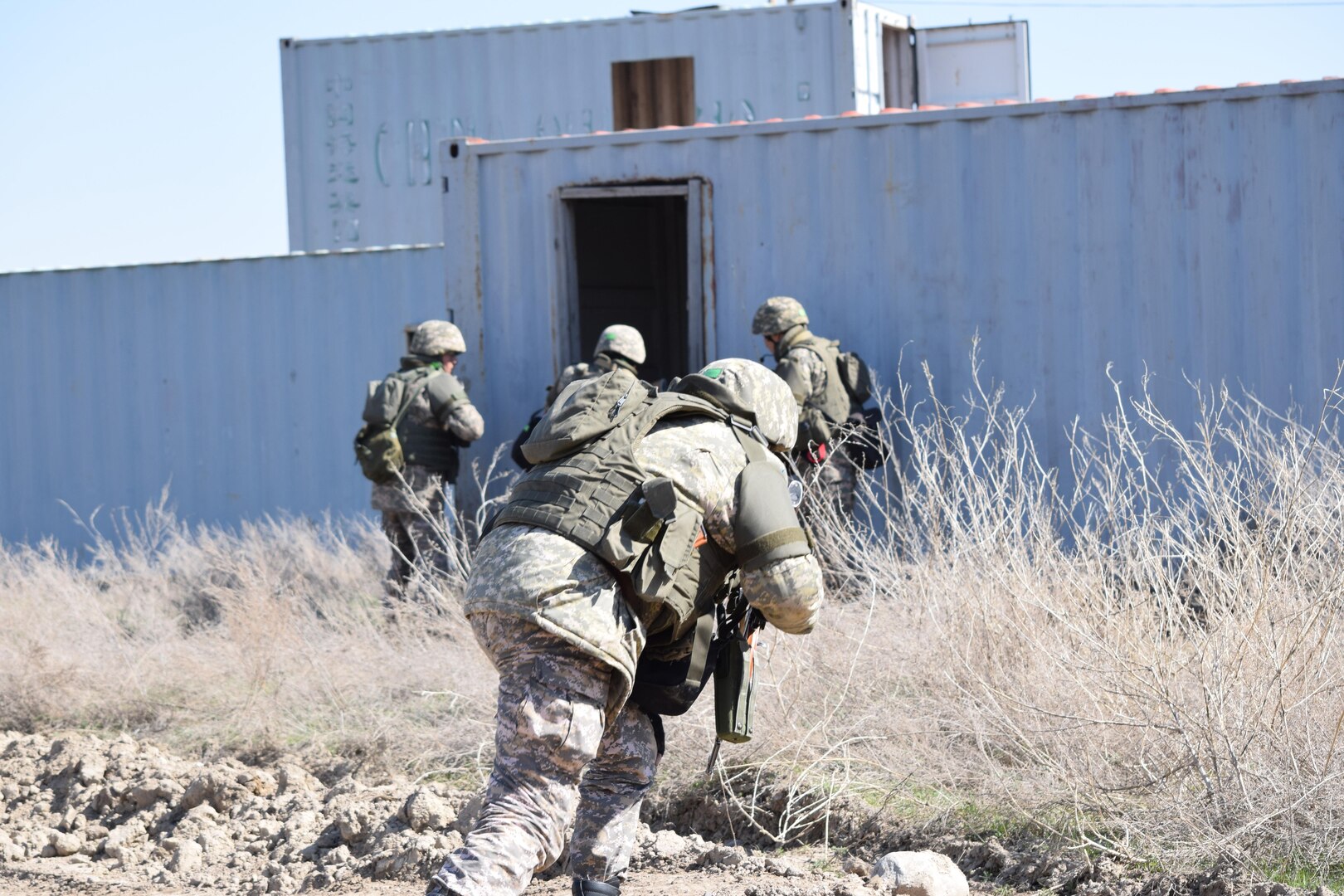 A Kazakhstani soldier runs toward cover during a cordon and search scenario for Steppe Eagle Koktem Apr. 10, 2017, at Illisky Training Center, Kazakhstan.