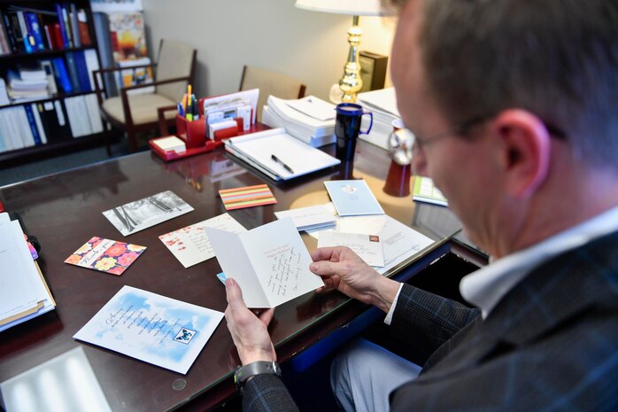 Brad Stanley, 628th Air Base Wing Office of the Staff Judge Advocate Civil Law division chief, reads a thank you note from a person he helped go through the naturalization process here, April 13, 2017. Members of 628th ABW JA have assisted more than 300 service members and their families receive their citizenship since the Joint Base Charleston Immigration Clinic was created in 2008.