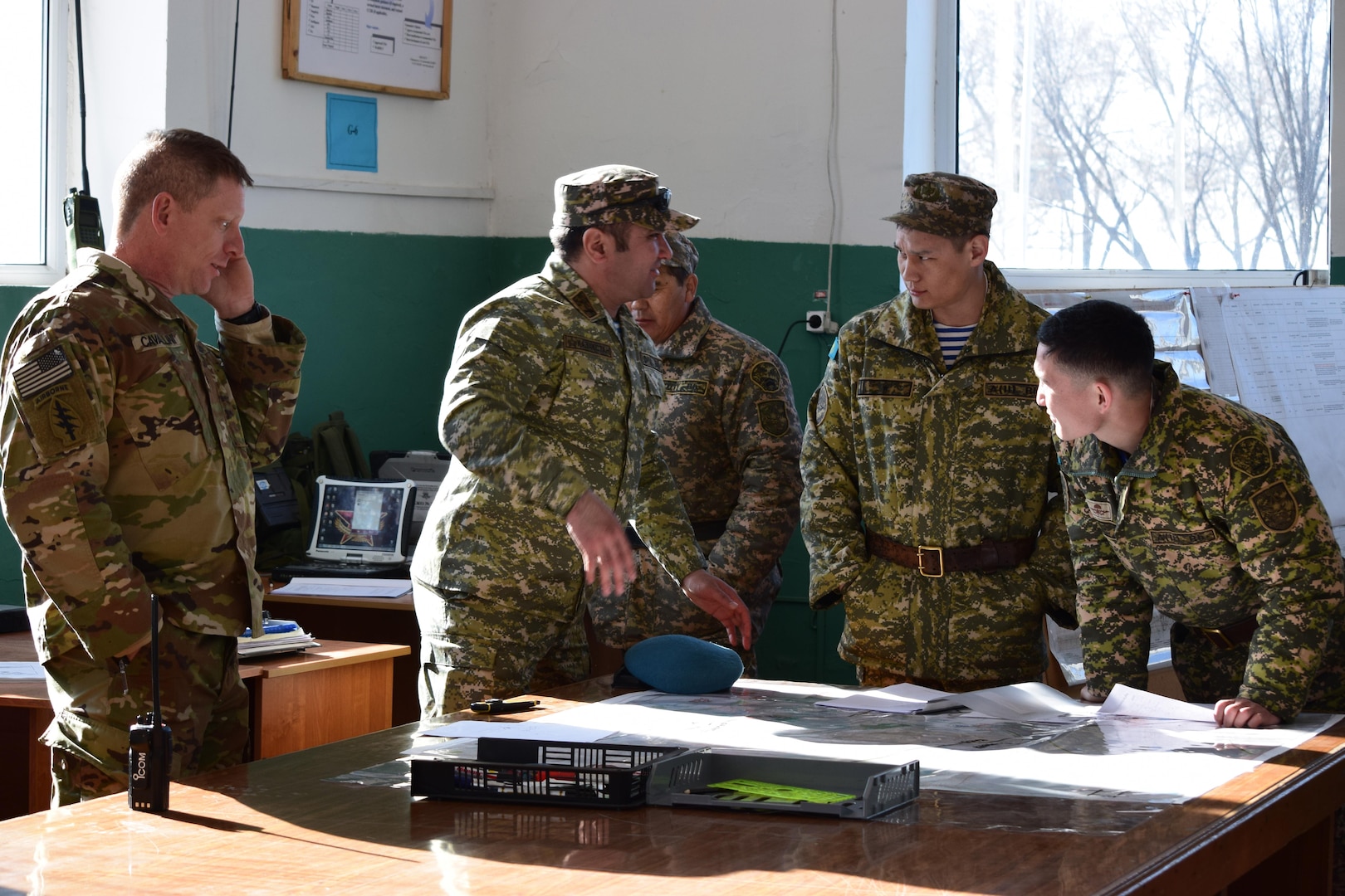 Kazakhstani soldiers with the Kazakhstan Peacekeeping Brigade discuss the practical exercises that occured over the last three days of Steppe Eagle Koktem Apr. 9, 2017, at Illisky Training Center, Kazakhstan. The practical exercises allowed the soldiers with the Kazakhstan Peacekeeping Battalion to demonstrate and further develop the skills they worked on during the military-to-military engagements of the week prior.