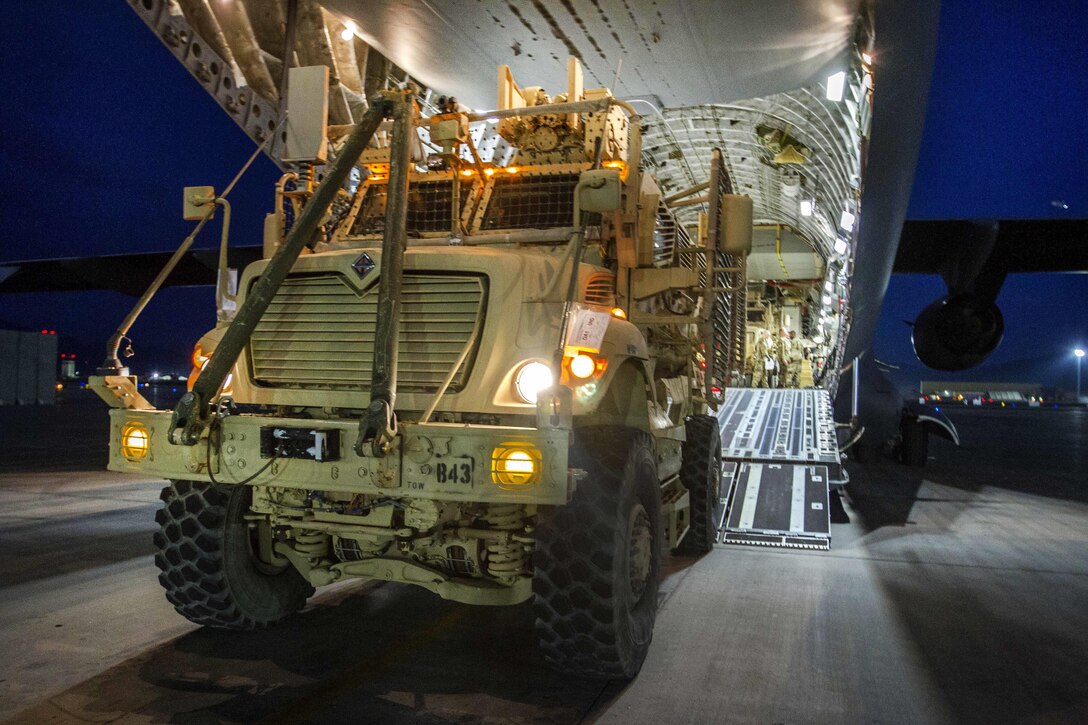 Soldiers load mine-resistant, ambush-protected vehicles onto a C-17 Globemaster III at Bagram Airfield, Afghanistan, April 9, 2017. Army photo by Sgt. 1st Class Eliodoro Molina