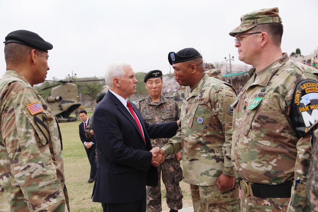 Vice President Mike Pence shakes hands with Command Sgt. Maj. Steven L. Payton, senior enlisted advisor for United Nations Command, Combined Forces Command and U.S. Forces Korea, near the Demilitarized Zone in South Korea, April 17, 2017. Pence is on his first trip to South Korea as vice president. Army photo by Sgt. 1st Class Sean K. Harp