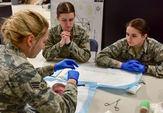 Members of the 914th Aeromedical Staging Squadron participate in a medical stitching exercise on Monday, April 10, 2017 at the Niagara Falls Air Reserve Station.  The training fulfills requirements in order to maintain medical skills and a current, qualified, mission ready force.  (U.S. Air Force photo by Staff Sgt. Richard Mekkri)