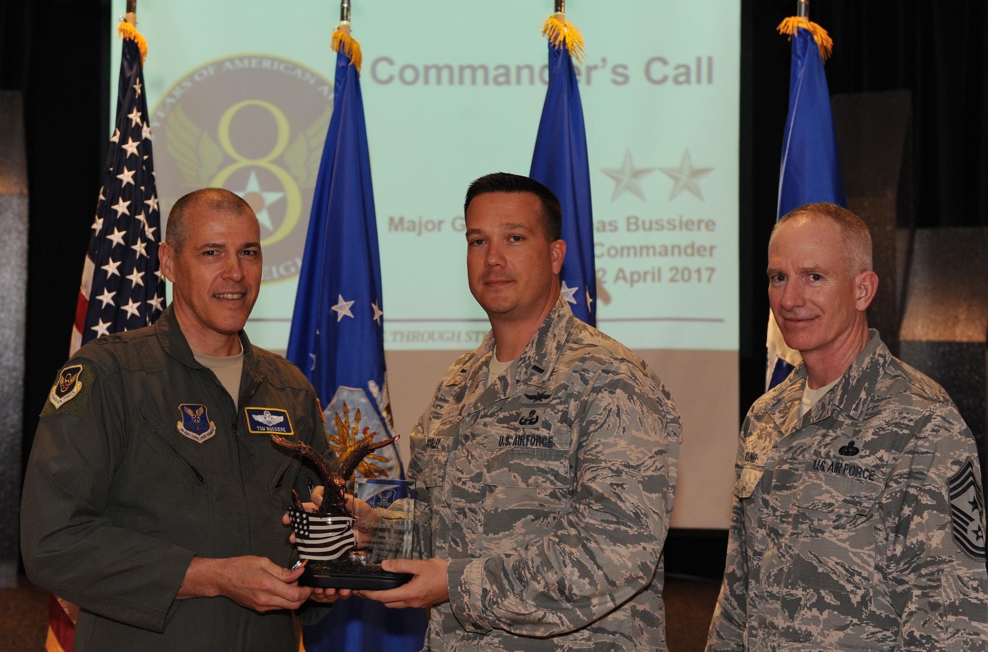 U.S. Air Force Maj. Gen. Thomas Bussiere, Eighth Air Force commander, left, and Chief Master Sgt. Alan Boling, Eighth Air Force command chief, far right, recognizes Tech. Sgt. Matthew Yatsko (not pictured) as the Air Force Global Strike Command’s 2016 Air Force Outstanding Cyber Warfare Noncommissioned Officer of the Year nominee during a Headquarters Eighth Air Force commanders call at Barksdale Air Force Base, La., April 12, 2017. Various topics pertinent to the organization were discussed throughout the event, followed by a question and answer engagement session with the Airmen. (U.S. Air Force photo by Senior Airman Erin Trower)