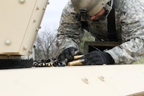 A U.S. Army Reserve Sgt. 1st Class Paul Edwards, 492nd Civil Affairs Battalion, U.S. Army Civil Affairs and Psychological Operations Command, collects brass after completing basic live fire during Operation Cold Steel at Fort McCoy, Wis., April 15, 2017. Operation Cold Steel is the U.S. Army Reserve's crew-served weapons qualification and validation exercise to ensure that America's Army Reserve units and Soldiers are trained and ready to deploy on short-notice and bring combat-ready and lethal firepower in support of the Army and our joint partners anywhere in the world. (U.S. Army Reserve photo by Staff Sgt. Debralee Best, 84th Training Command)