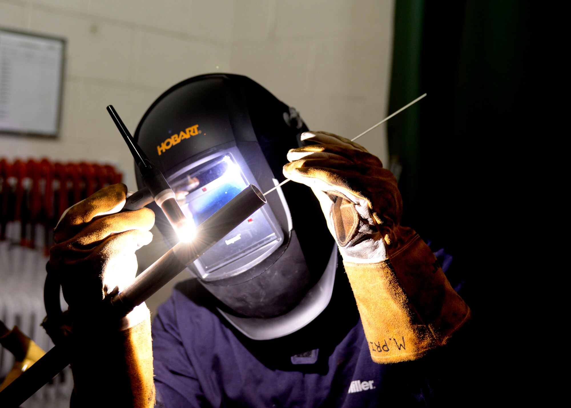 Senior Airman Matt Prive, an aircraft metals technician from the 157th Maintenance squadron, welds a piece of aluminum in the maintenance welding shop on Pease Air National Guard Base, N.H. April 2, 2017. The maintenance shop is responsible for welding damaged fuel pipes made of aluminum.