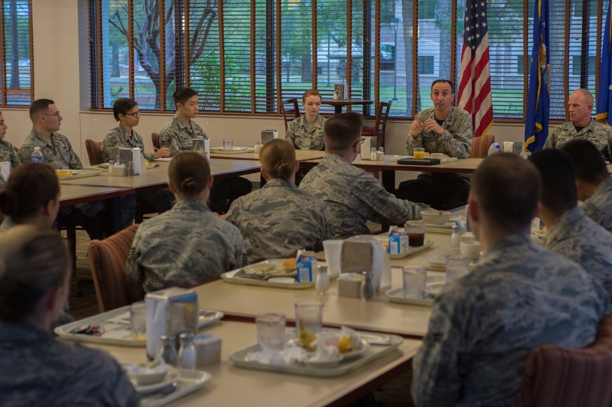 U.S. Air Force Maj. Gen. Scott Zobrist, 9th Air Force commander, and Chief Master Sgt. Frank Batten III, 9th Air Force command chief, speak with Airmen assigned to the 20th Fighter Wing during breakfast at the Chief Master Sgt. Emerson E. Williams Dining Facility at Shaw Air Force Base, S.C., March 31, 2017. Zobrist took the opportunity to encourage those Airmen involved in 
