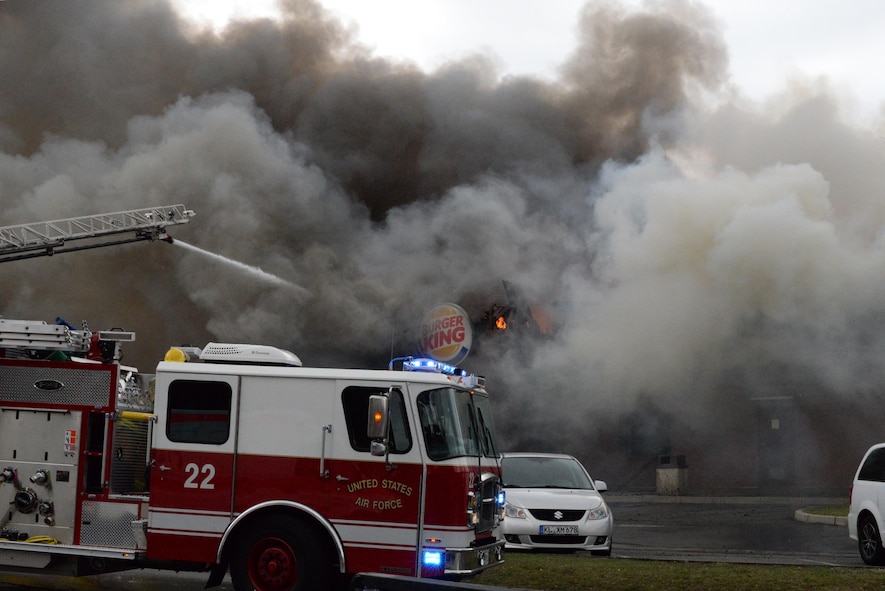 86th Civil Engineer Group Airmen respond to a fire at bldg. 1135, April 16, 2017 on Ramstein Air Base, Germany. According to base officials, the fire was contained and there was one minor injury, of a firefighter. The cause of the incident is under investigation. (U.S. Air Force photo by Airmen 1st Class D. Blake Browning)