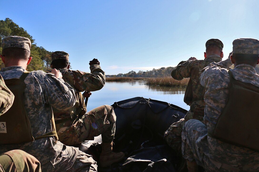 Soldiers move over calm waters during combat rubber raiding craft familiarization training at Virginia Beach, Va., April 9, 2017. Army National Guard photo by Sgt. Amanda H. Johnson