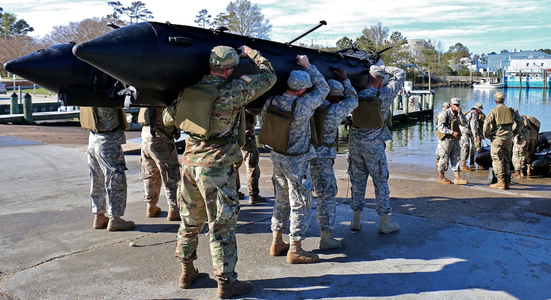 Soldiers prepare to put their rubber watercraft into the water before participating in combat rubber raiding craft familiarization at Virginia Beach, Va., April 9, 2017. Army National Guard photo by Sgt. Amanda H. Johnson