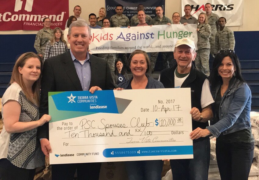 The Peterson, Schriever, Cheyenne Mountain Spouse Club received a grant from the Tierra Vista Communities at Schriever Air Force Base, Colorado, Tuesday, April 10, 2017. The mission of KAH, a humanitarian food-aid organization incorporated in 1999, is to significantly reduce the number of hungry children in the United States and to feed starving children throughout the world. (Courtesy photo)
