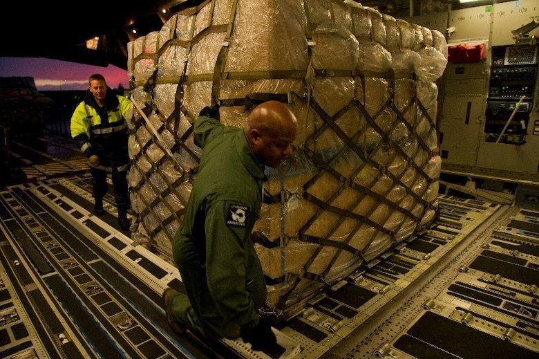 A member of the Royal New Zealand Air Force (RNZAF) helps U.S. Air Force Master Sgt. Marc Staten, 304th Expeditionary Airlift Squadron loadmaster, move a pallet onto a U.S. Air Force C-17 Globemaster III during Operation Deep Freeze (ODF), July 15, 2016 at Christchurch International Airport, New Zealand. ODF is a joint operation between the U.S. Air Force, the National Science Foundation, and the RNZAF. Every year, a joint and total force team works to complete a successful ODF season.