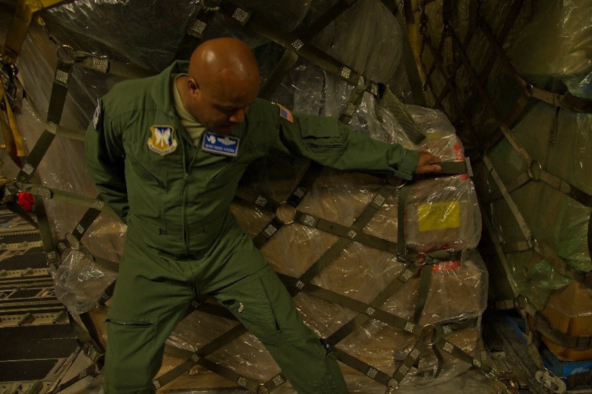 U.S. Air Force Master Sgt. Marc Staten, 304th Expeditionary Airlift Squadron loadmaster, moves a pallet onto a C-17 Globemaster III, during Operation Deep Freeze (ODF), July 15, 2016 at Christchurch International Airport, New Zealand. ODF is a joint operation between the U.S. Air Force, the National Science Foundation, and the Royal New Zealand Air Force.   (U.S. Air Force Reserve photo by Staff Sgt. Madelyn McCullough)