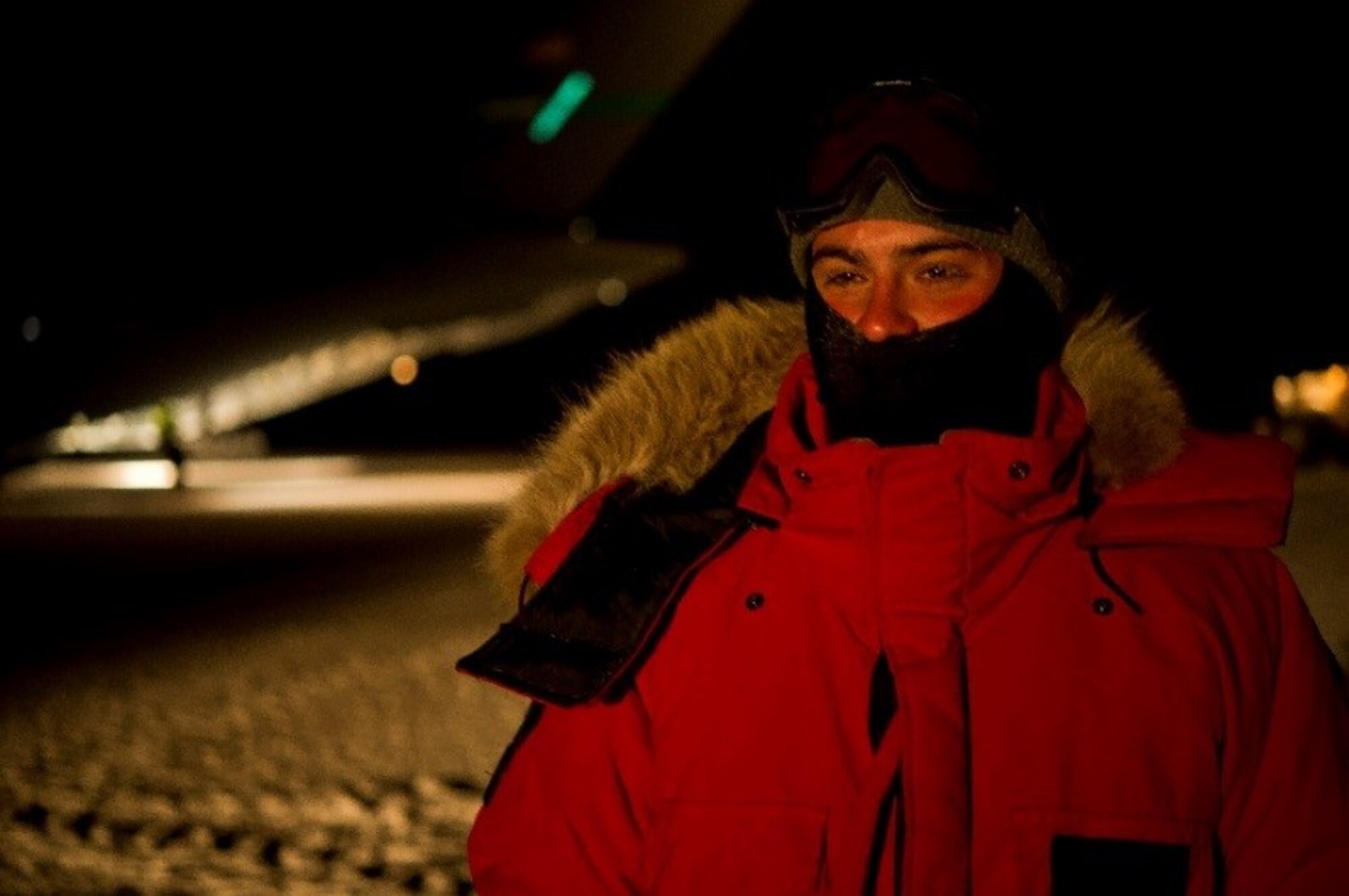 160715-F-GD533-014 – U.S. Air Force Staff Sgt. Kirk Halsey, 304th Expeditionary Airlift Squadron crew chief, dawns extreme cold weather gear as he stands in front of a C-17 Globemaster III during Operation Deep Freeze (ODF), July 15, 2016, at Pegasus Ice Runway, Antarctica. ODF is one of the most difficult U.S. military peacetime missions due to the austere environment in which it is conducted. Therefore, extreme cold weather gear, including polar fleeces, balaclavas (ski masks), mukluks (soft boots designed for cold weather), cold weather gloves, ear bands, neck gaiters, hats, polar fleece pants, insulated cold weather bibs, extreme cold weather parkas, is issued to personnel in order for them to be prepared to support this vital mission. (U.S. Air Force Reserve photo by Staff Sgt. Madelyn McCullough