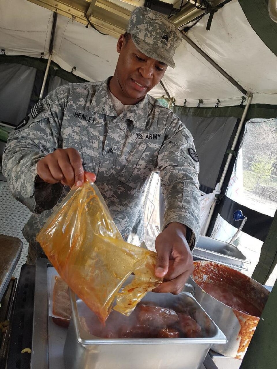 North Carolina Army National Guard Sgt. Daledrick Henley prepares dinner in a mobile kitchen trailer near the dining facility at the 1st Republic of Korea Marine camp during Operation Pacific Reach Exercise 17 in Pohang, South Korea, April 14, 2017. Army photo by Sgt. Uriah Walker