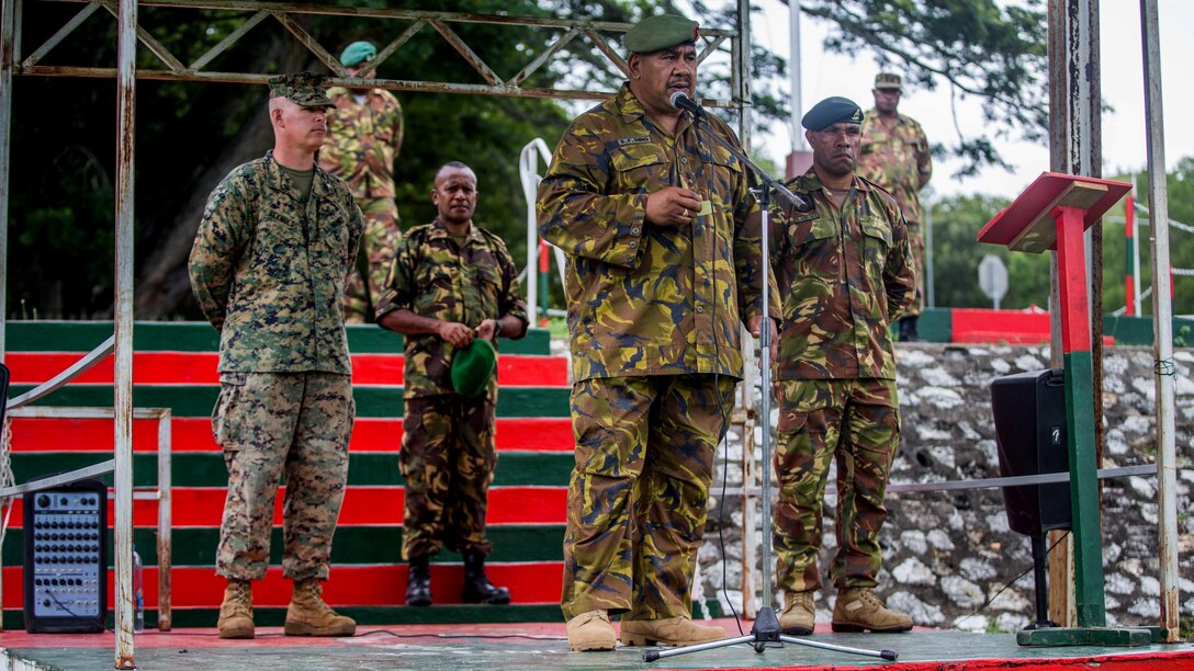 Col. Siale F. Diro, the Chief of Force Preparation, Papua New Guinea Defense Force, speaks during the opening ceremony of a bilateral military exchange held between the 11th Marine Expeditionary Unit and the PNGDF at Taurama Barracks, held as part of a theater security cooperation engagement, April 15. In order to prepare the PNGDF to support local police at upcoming national-level events, the Marines and Sailors with the 11th MEU will host bilateral training pertinent to civil authority operations, such as: entry control and vehicle check points, escalation of force tactics, personnel searches, urban patrolling and VIP escorts.