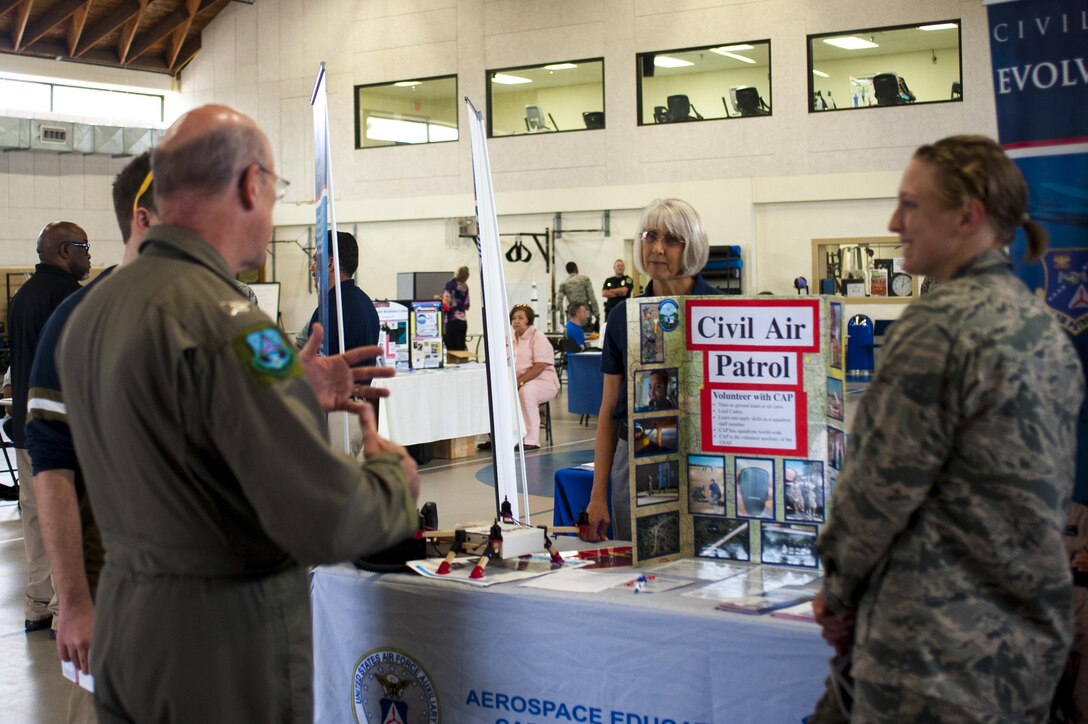 Cynthia Nussey, Civil Air Patrol deputy command of cadets, explains CAP during the volunteer fair at the Carswell Field House on Goodfellow Air Force Base, Texas, April 13, 2017. The volunteer fair is held annually to assist individuals interested in finding volunteer opportunities. Each stand has a signup sheet for inquiring individuals. (U.S. Air Force photo by Senior Airman Scott Jackson/Released)