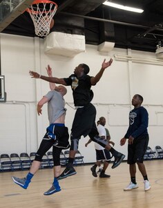 Joint Base Andrews members play in a three-on-three basketball game at the West Fitness Center on JBA, Md., April 14, 2017. The game was part of a fundraising tournament supporting the Air Force Assistance Fund campaign.  Air Force bases worldwide participate in this campaign, raising money for four Air Force charities: Air Force Aid Society, Air Force Enlisted Village, Air Force Villages Charitable Foundation and the General and Mrs. Curtis E. LeMay Foundation.  (U.S. Air Force photo by Airman 1st Class Rustie Kramer)