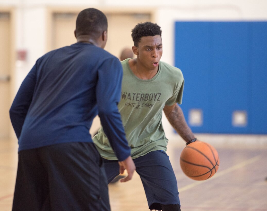 Airman 1st Class Julian Gerald, 11th Civil Engineer Squadron heating, ventilation and air conditioning technician, plays in a three-on-three basketball game at the West Fitness Center on Joint Base Andrews, Md., April 14, 2017. The game was part of a fundraising tournament supporting the Air Force Assistance Fund campaign.  Air Force bases worldwide participate in this campaign, raising money for four Air Force charities: Air Force Aid Society, Air Force Enlisted Village, Air Force Villages Charitable Foundation and the General and Mrs. Curtis E. LeMay Foundation.  (U.S. Air Force photo by Airman 1st Class Rustie Kramer)