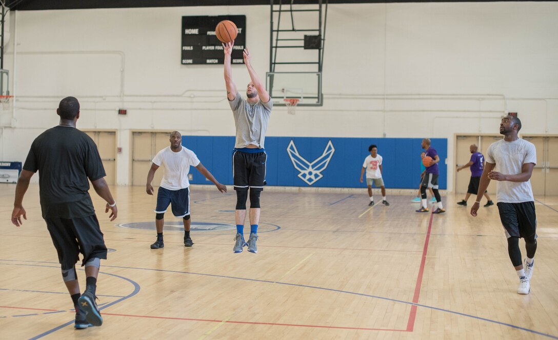 Senior Airman Jacob Lowe, 11th Civil Engineer Squadron water and fuels maintenance member, pulls up for an outside jump-shot during a three-on-three basketball game at the West Fitness Center on Joint Base Andrews, Md., April 14, 2017. The game was part of a fundraising tournament supporting the Air Force Assistance Fund campaign.  Air Force bases worldwide participate in this campaign, raising money for four Air Force charities: Air Force Aid Society, Air Force Enlisted Village, Air Force Villages Charitable Foundation and the General and Mrs. Curtis E. LeMay Foundation.  (U.S. Air Force photo by Airman 1st Class Rustie Kramer)