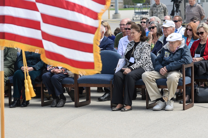Retired Doolittle Raider, Lt. Col. Dick Cole, (front right) watches an unveiling ceremony for the new Ruptured Duck artwork, Apr. 17, 2017 at Wright-Patterson Air Force Base, Ohio. Cole is the last remaining member of the original Doolittle Raiders who took off from an aircraft carrier to deliver the first strike of the war on Japanese homeland. (U.S. Air Force photo by Wesley Farnsworth)