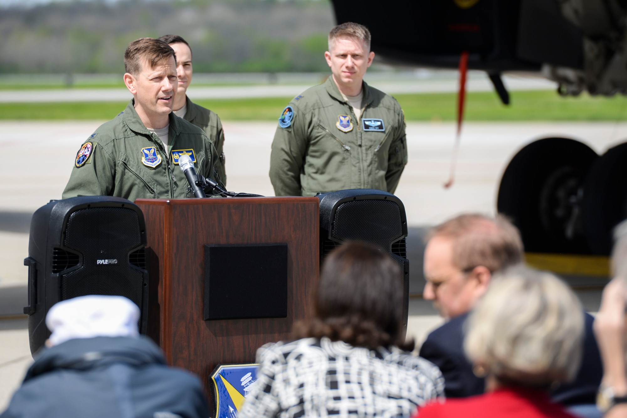 U.S. Air Force Col. John Martin, 28th Operations Group commander from Ellsworth Air Force Base, S.D., addresses a crowd consisting of retired Doolittle Raider, Lt. Col. Dick Cole, along with family and friends of past Doolittle Raiders, during an unveiling ceremony for the new Ruptured Duck artwork, Apr. 17, 2017 at Wright-Patterson Air Force Base, Ohio.  The Ruptured Duck history began when pilot Ted Lawson scraped the tail of his B-25 when he pointed the nose of the aircraft too high before takeoff. His aircraft was then chalked with the “Ruptured Duck”, and later the first caricature of the angry duck with crutches was painted on the nose. (U.S. Air Force photo by Wesley Farnsworth)