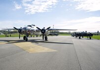 B-25 Mitchell bombers sit parked in a runway next to the National Museum of the U.S. Air Force at Wright-Patterson Air Force Base, Ohio, April 17, 2017. The 11 World War II era bombers landed at the museum to take part in its celebration of the 75th anniversary of the Doolittle Raid when Army Air Corps bombers took off from an aircraft carrier to deliver the first strike of the war on the Japanese homeland. (U.S. Air Force photo by R.J. Oriez/Released)