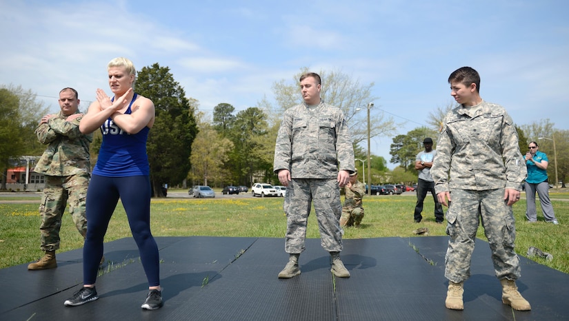 U.S. Army Soldiers learn proper falling techniques from Kayla Harrison, Olympic Gold Medalist for Judo, during a Sexual Assault Awareness and Prevention Month event at Joint Base Langley-Eustis, Va., April 14, 2017. Harrison taught Soldiers how to toss their opponent and defend themselves in a combative situation. (U.S. Air Force photo/Airman 1st Class Kaylee Dubois)
