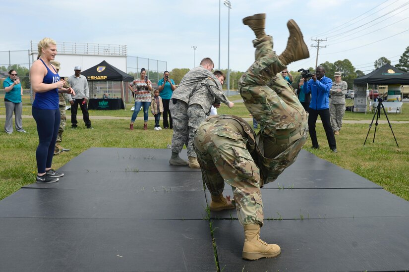 U.S. Army Soldiers flip each other during a Judo training with Kayla Harrison, Olympic Gold Medalist, as part of a Sexual Assault Awareness and Prevention Month event at Joint Base Langley-Eustis, Va., April 14, 2017. During the event, Soldiers had the opportunity to ask Harrison about her time as an Olympic athlete, her sexual assault experience and her judo techniques. (U.S. Air Force photo/Airman 1st Class Kaylee Dubois)