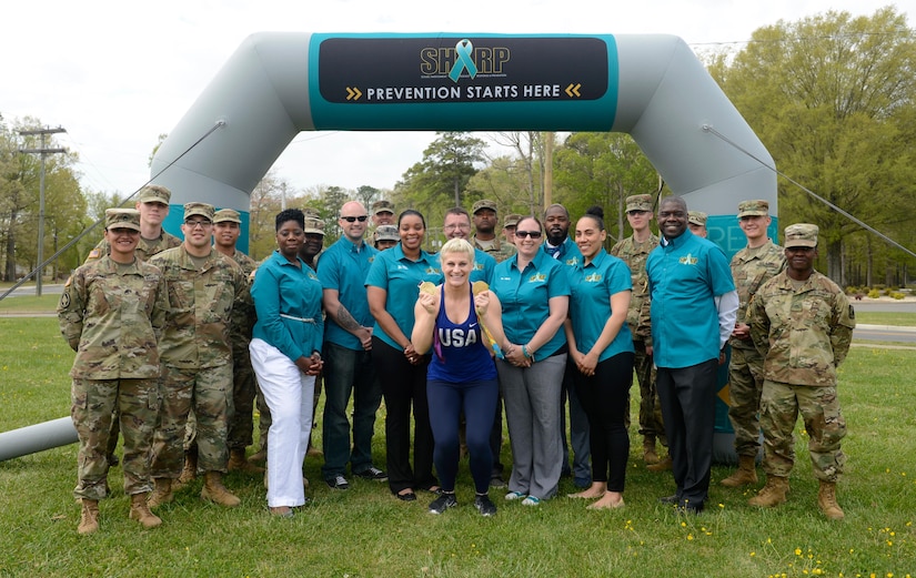 U.S. Army Soldier and Sexual Harassment, Assault Response and Prevention team members pose with Kayla Harrison, Olympic Gold Medalist, during a Sexual Assault Awareness and Prevention Month event at Joint Base Langley-Eustis, Va., April 14, 2017. Harrison, the guest speaker for the event, talked about raising sexual assault awareness, as well as setting and reaching goals to help survivors overcome trauma. (U.S. Air Force photo/Airman 1st Class Kaylee Dubois)