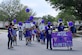 Members of Team Charleston from the Childcare Development Center hold up signs during a parade here for a Month of the Military Child celebration, April 14, 2017. April is designated as Month of the Military Child to recognize the 1.7 million military children across the globe and the sacrifices they make alongside their parents. 