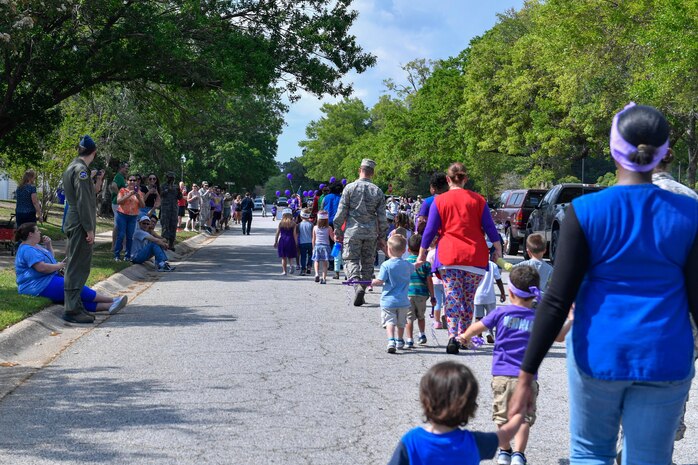 Parents clap as their children pass by during a parade here for Month of the Military Child, April 14, 2017. April is designated as Month of the Military Child to recognize the 1.7 million military children across the globe and the sacrifices they make alongside their parents.