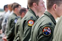 Members of the 34th Bomb Squadron from Ellsworth Air Force Base, S.D. stand in line during an unveiling ceremony for the new Ruptured Duck artwork, Apr. 17, 2017 at Wright-Patterson Air Force Base, Ohio.  The 34th BS lineage can be traced to one of the original Doolittle Raider squadrons. (U.S. Air Force photo by Wesley Farnsworth)